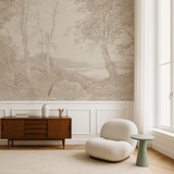 A room with light-colored landscape wallpaper depicting a serene outdoor scene, featuring a wooden sideboard and a modern armchair in the foreground.