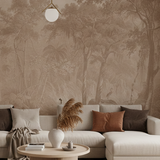 Living room with a forest mural wall, beige sofa, and decorative items.